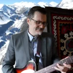 JackGIANTkillr playing guitar, the singer-songwriter behind Shades of the Afternoon